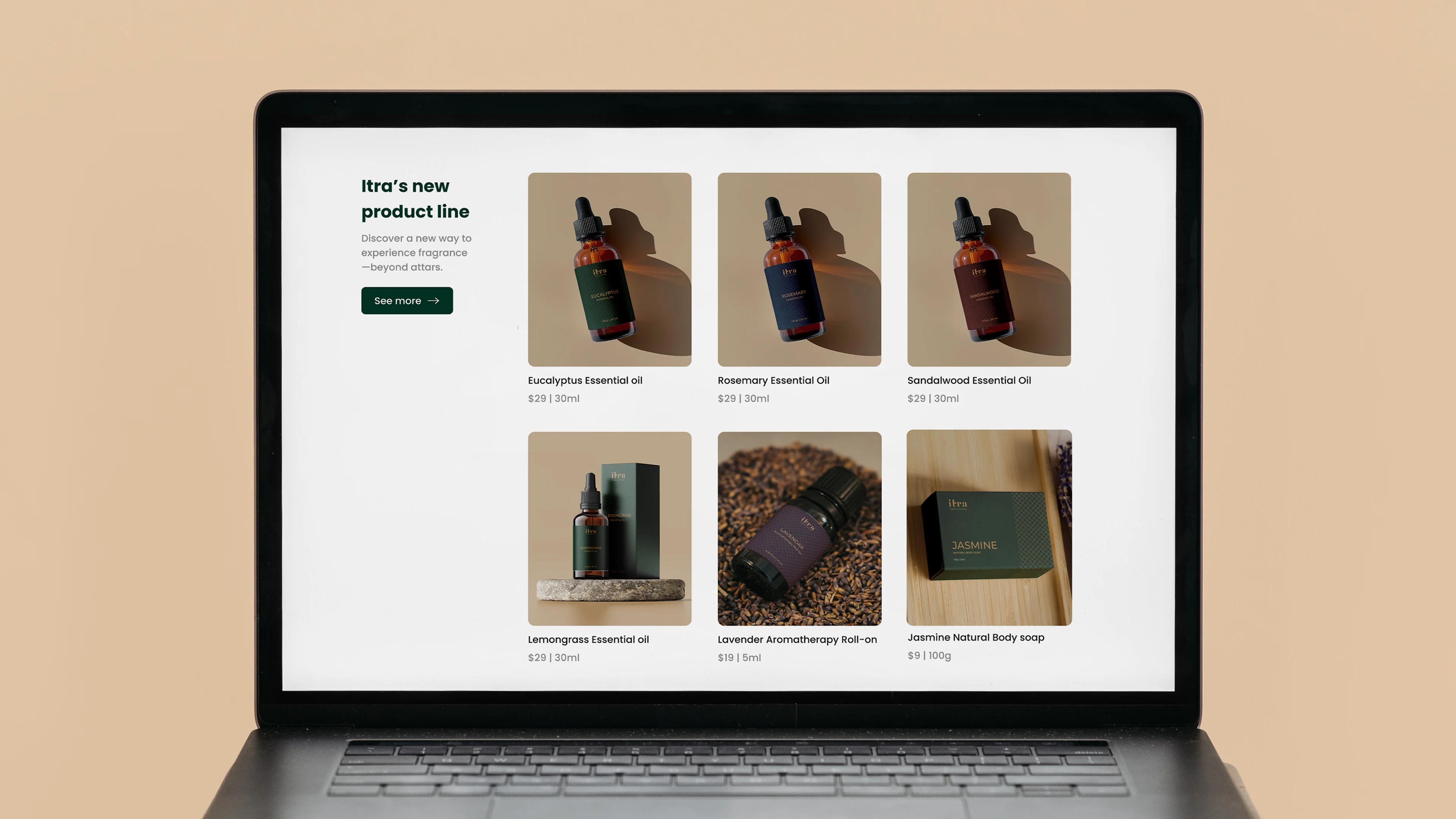 Itra website product grid on a MacBook screen showing six products — Eucalyptus, Rosemary, Sandalwood essential oils, Lemongrass, Lavender roll-on, and Jasmine soap — with prices in USD